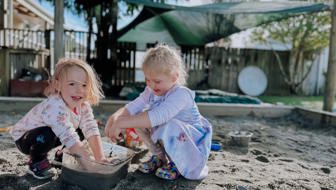 Evolve Education Preschool girls playing in sandpit at daycare