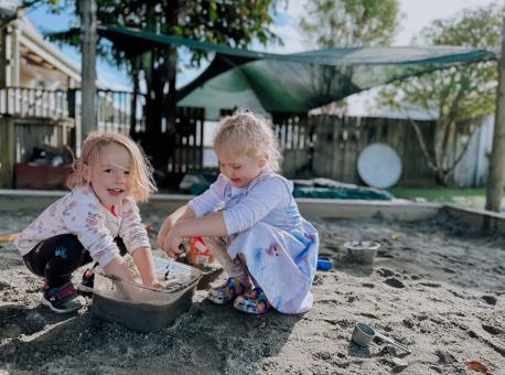 Evolve Education Preschool girls playing in sandpit at daycare